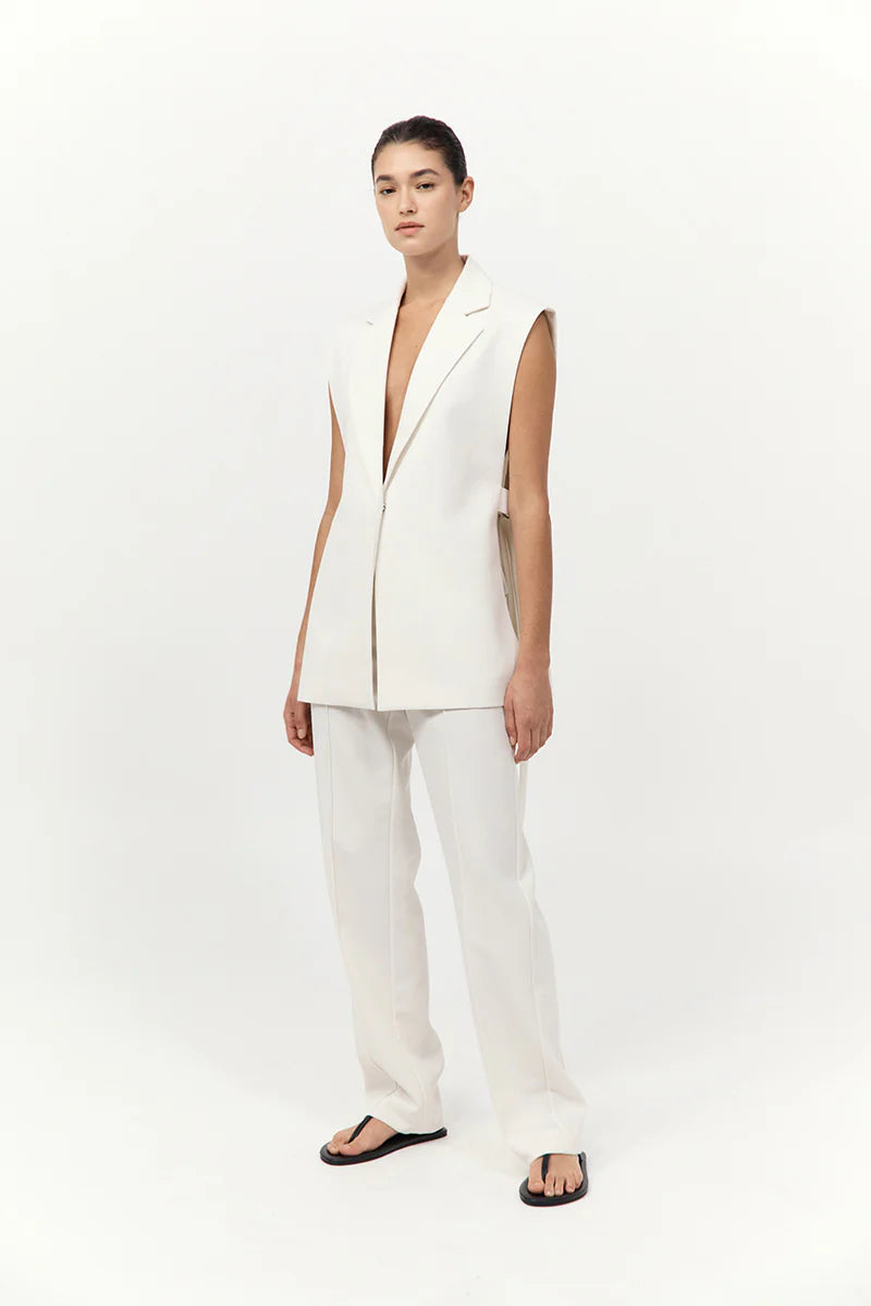 Close-up of the fabric details on the Relaxed Side Tie Vest in Off White, made from a soft wool blend by St. Agni.