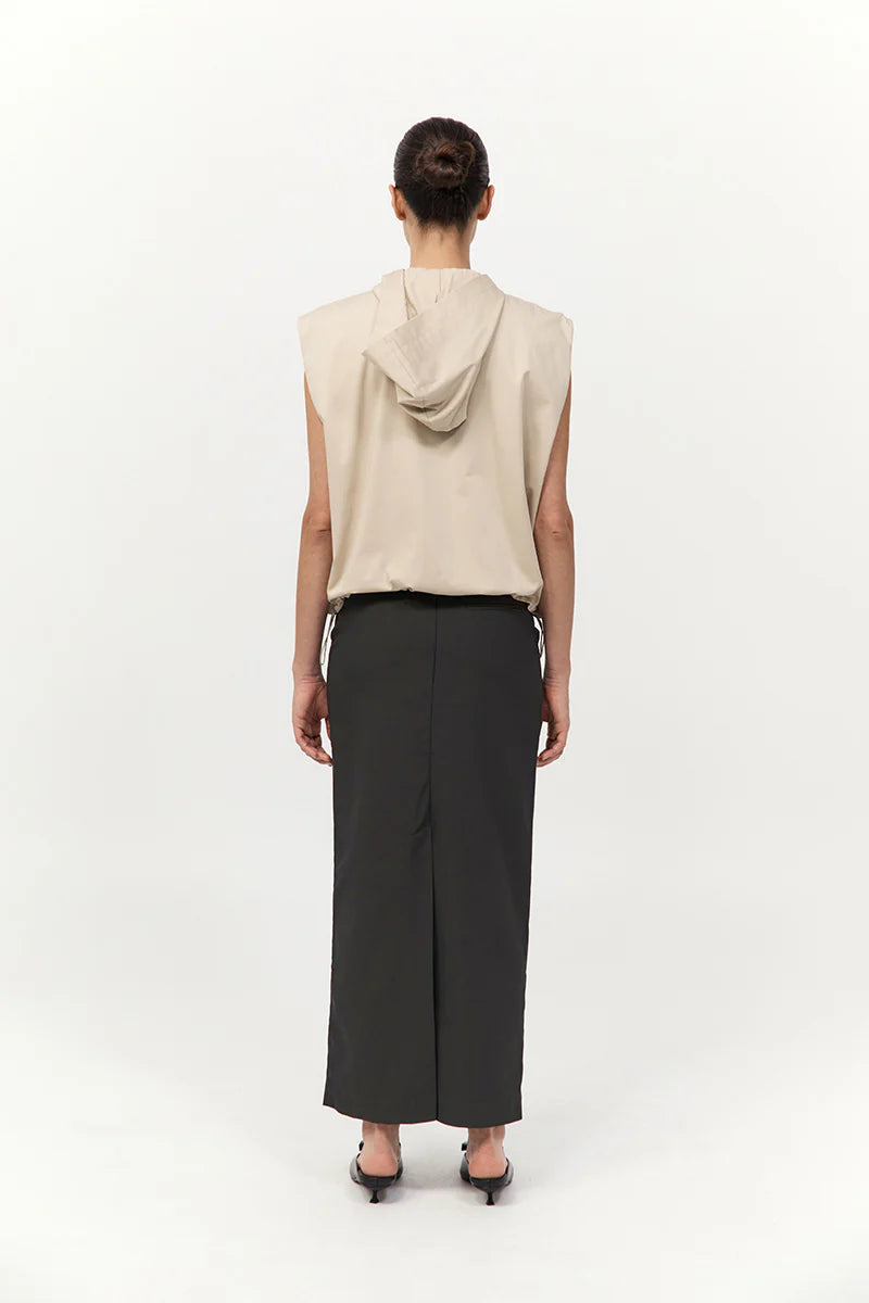 Model wearing the Cotton Sleeveless Parka in Champagne, demonstrating how this chic sleeveless parka coat fits and flows on a person.