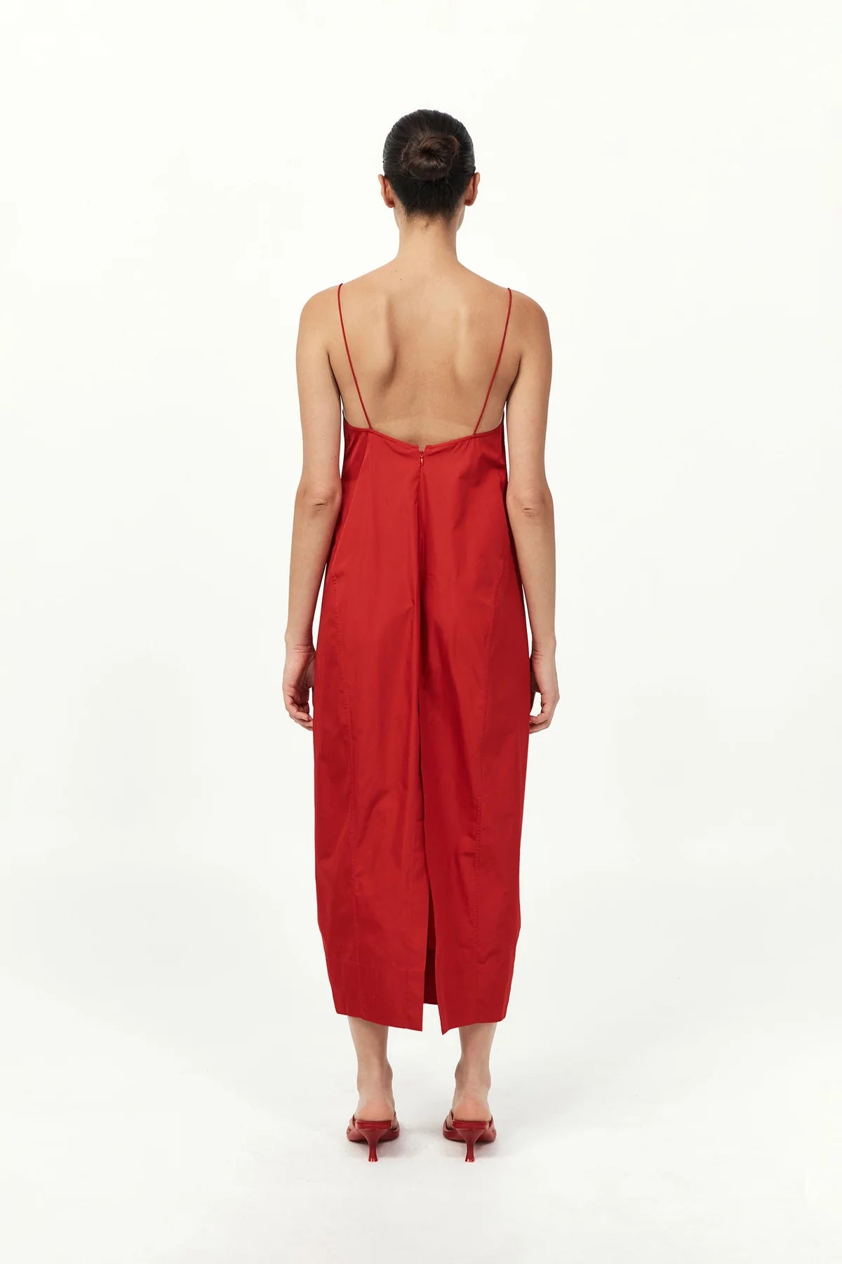 Back view of the Paper Taffeta Cocoon Dress in Red from St. Agni, emphasizing the elegant drape and stylish shape.