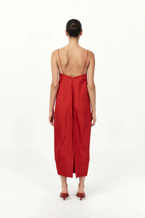 Back view of the Paper Taffeta Cocoon Dress in Red from St. Agni, emphasizing the elegant drape and stylish shape.