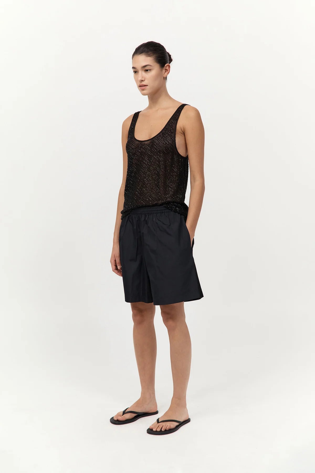 Model wearing the Glass Beaded Mesh Top by St. Agni in Jet Black, demonstrating its fluid drape and refined style.