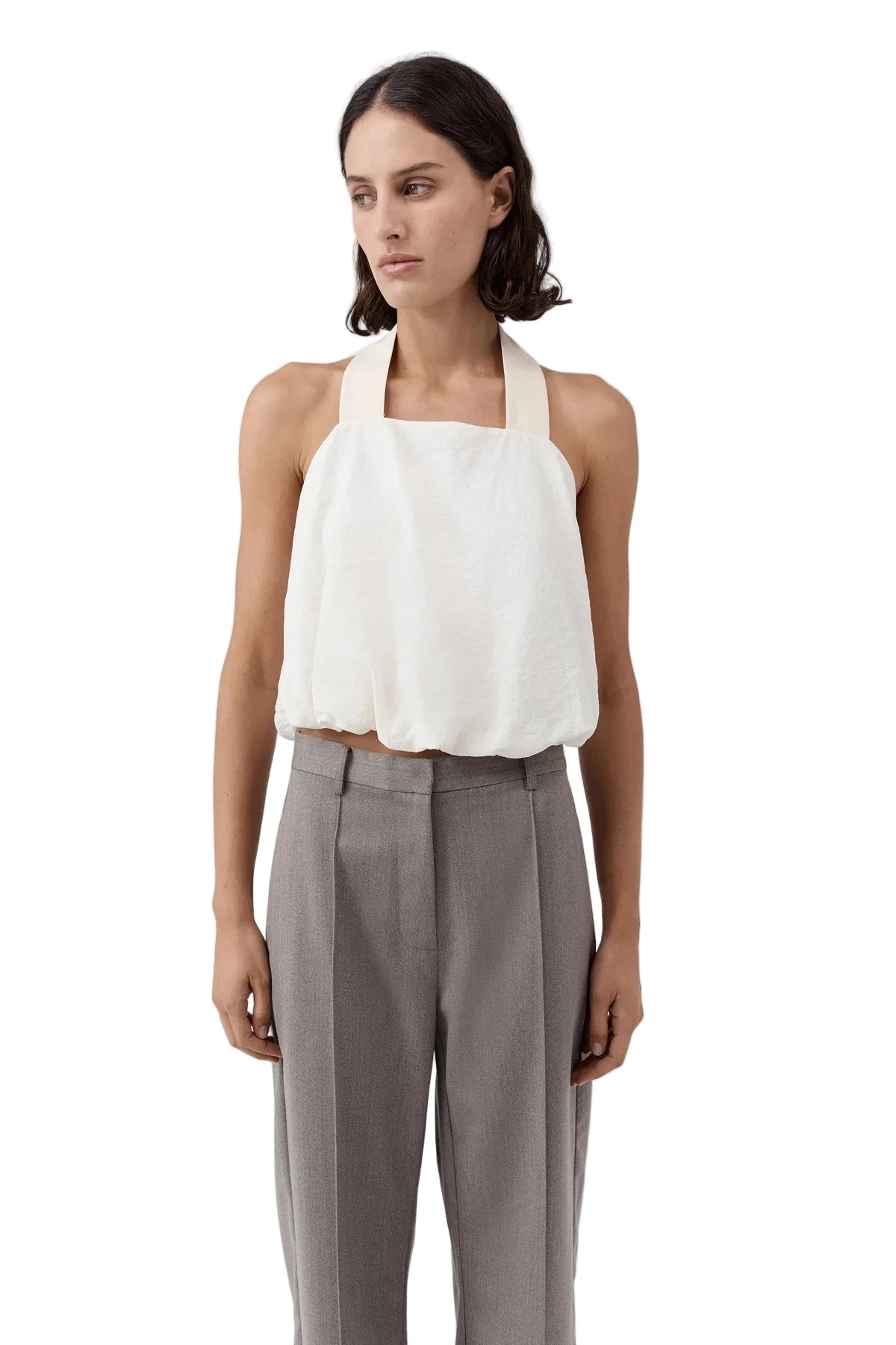 Side view of the Cloud Twist Halter Top in Off White, emphasizing its elegant straps and flowing shape.