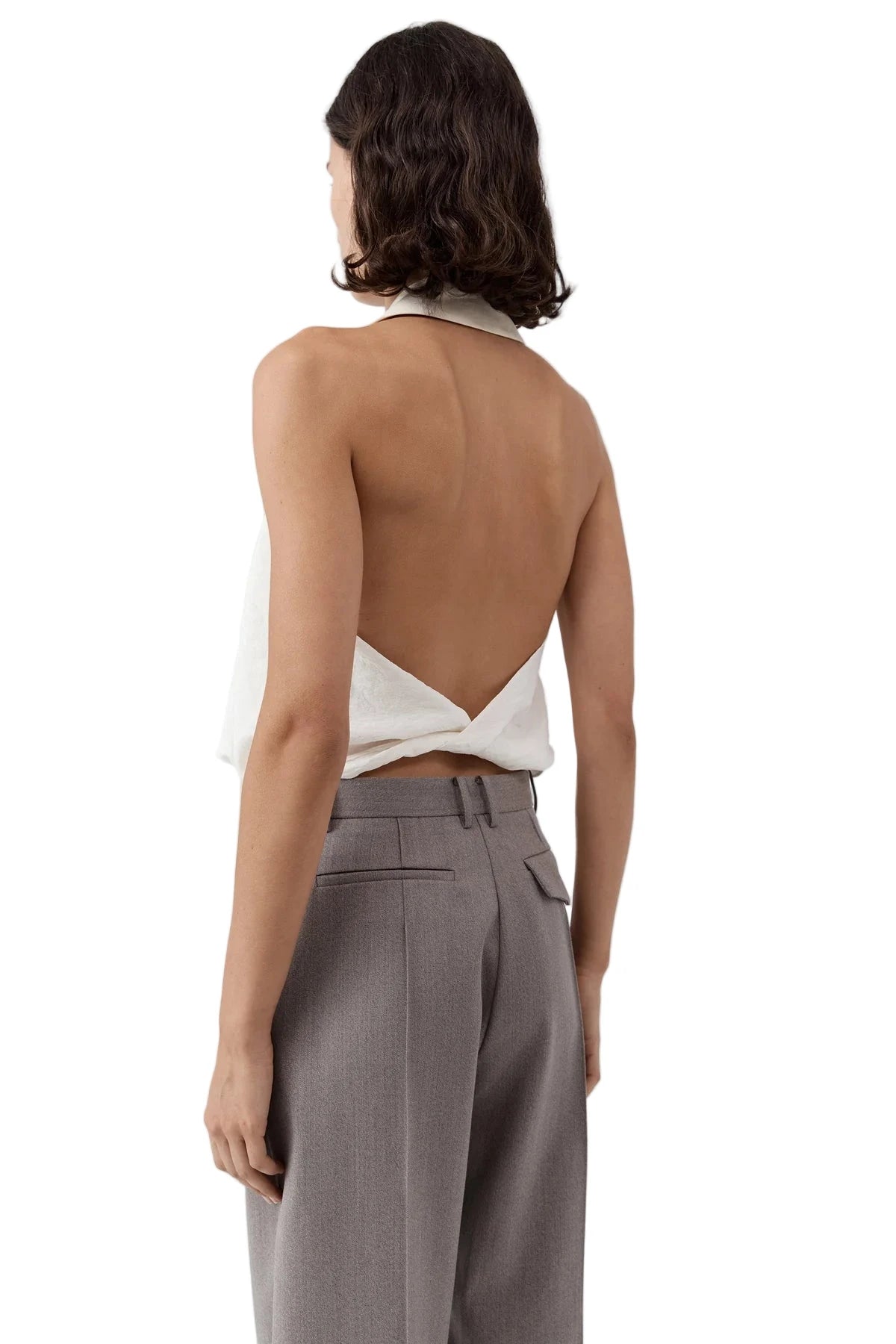 Flat lay of the Cloud Twist Halter Top in Off White, showcasing the beautiful fabric and sophisticated design.