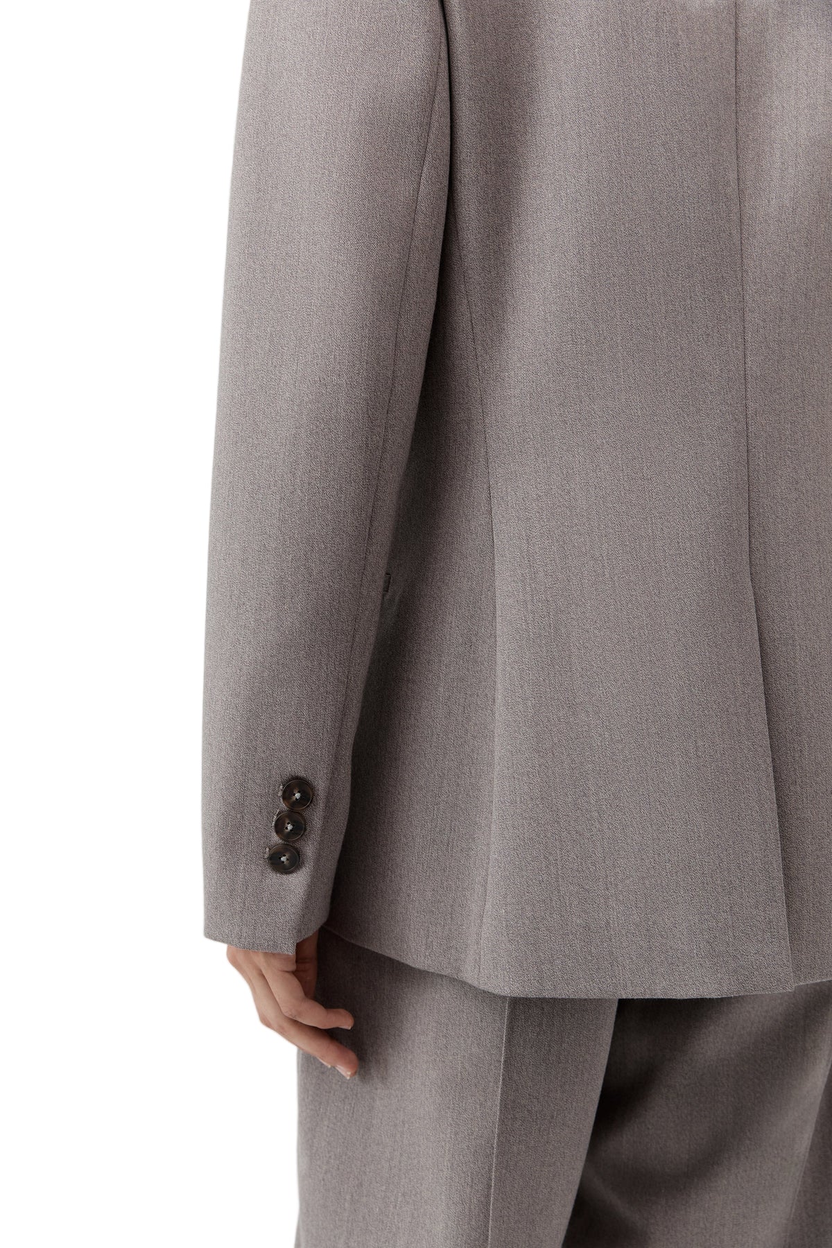 Full-body view of the 90s Wool Blazer in Doe worn by a model in a chic setting.