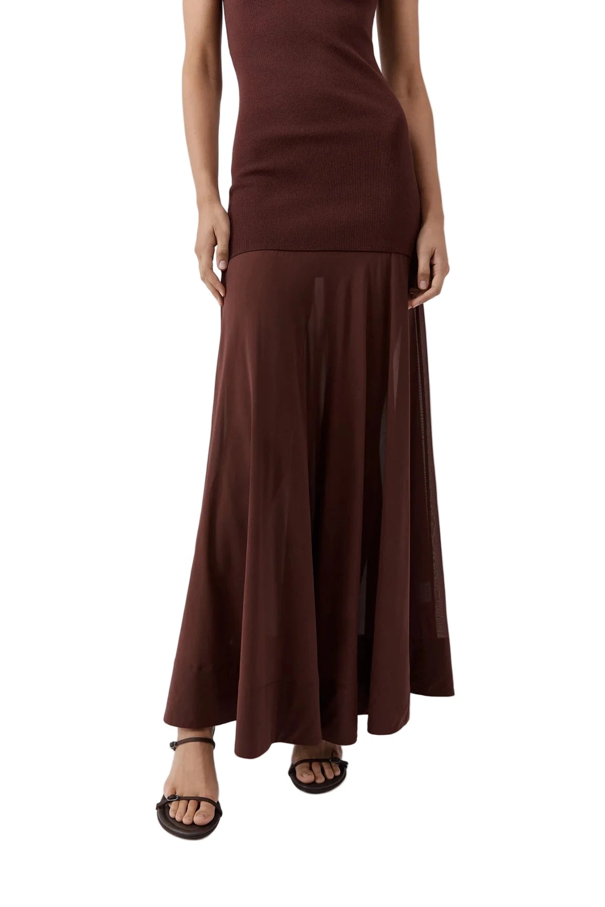 Model wearing the St. Agni Sheer Silk Circle Hem Dress in Liqueur at an evening event, showcasing its elegant design.