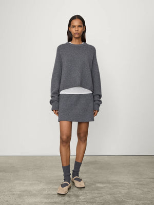 Close-up of the ribbed round neck of the Karine Sweater in Graphite, highlighting its luxurious cashmere texture.