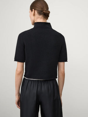 Back view of the Fride Sweater in Black by Lisa Yang, featuring the rolled hem design.