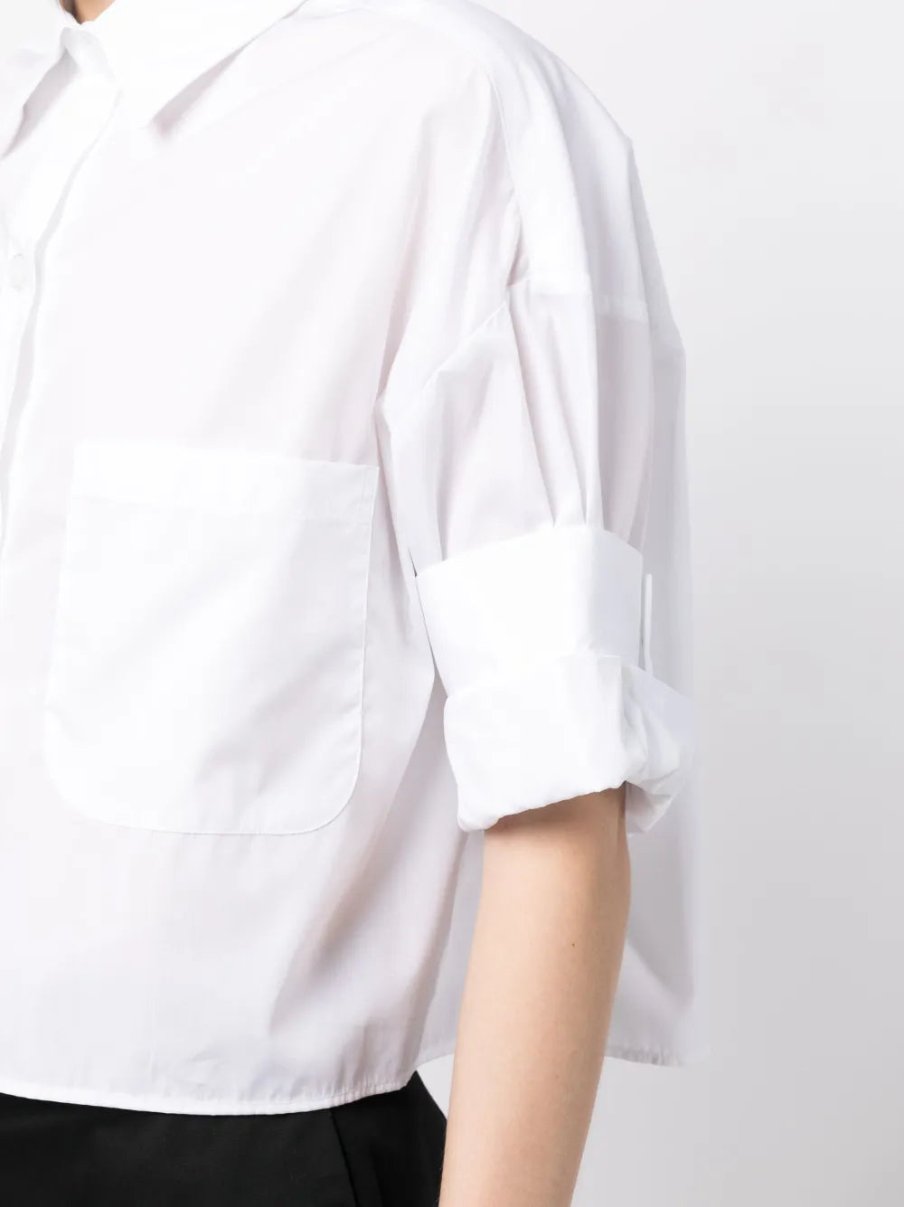 Flat lay of Next Ex in White, showcasing its stylish cropped fit and casual elegance for everyday wear.