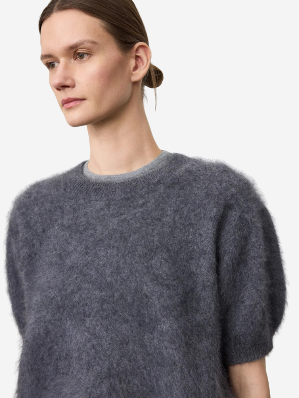 Juniper Sweater in Graphite displayed on a hanger, emphasizing the elegant crew neck and soft cashmere.