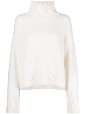 Fleur Sweater in Cream by Lisa Yang showcasing high neck and wide ribbing details.