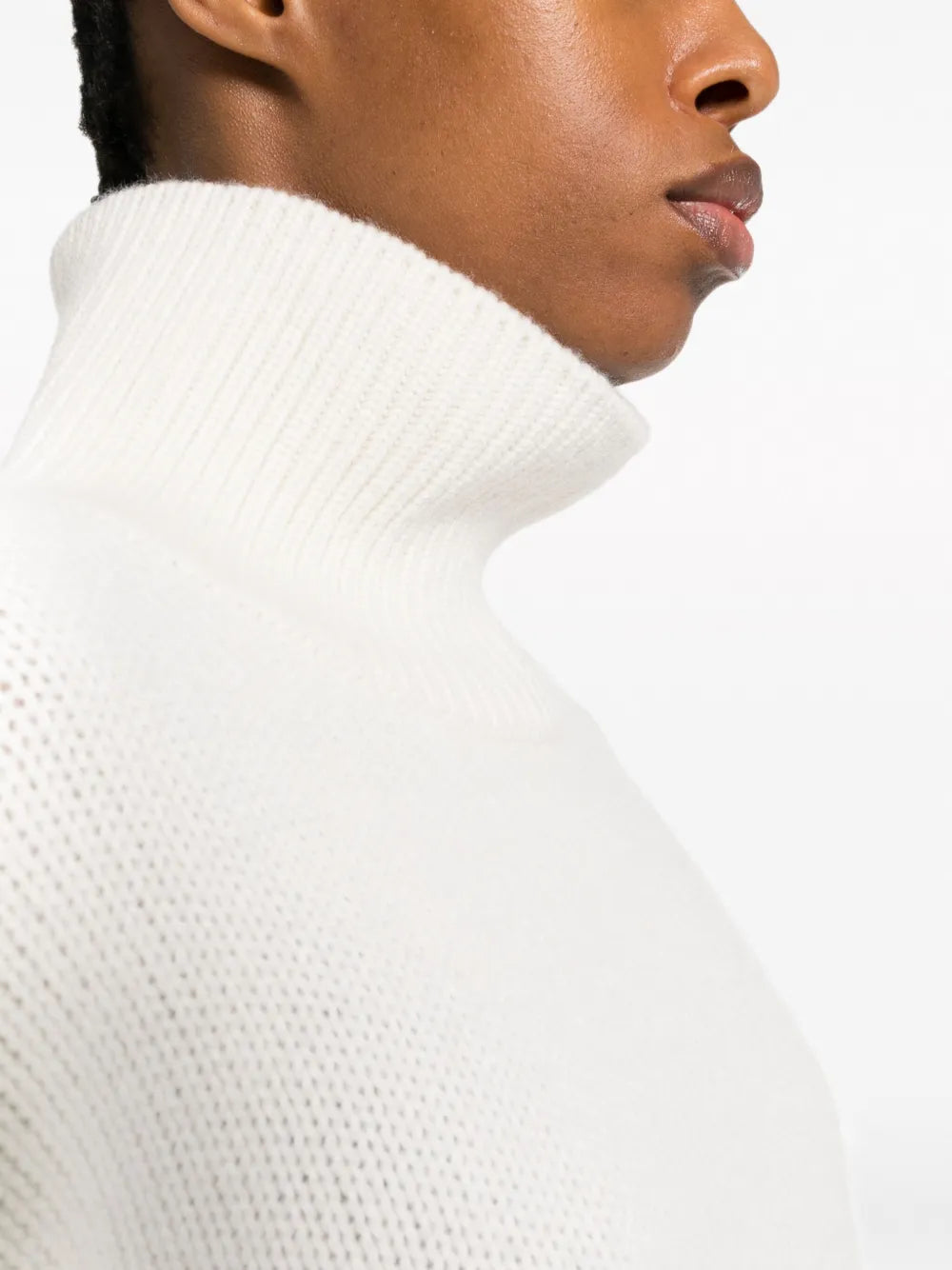 Fleur Sweater in Cream laid flat, emphasizing the elegant high neck design and soft cashmere.