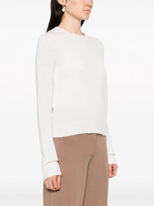Model wearing the Mable Sweater in Cream, featuring full-length sleeves and a slightly cropped hem.