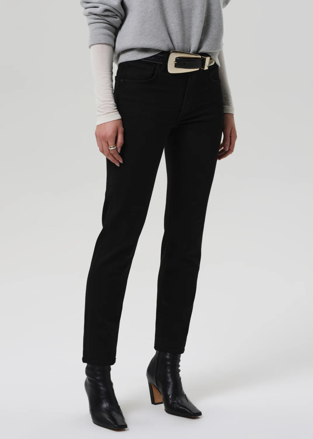 Isola Slim in Plush Black paired with casual knits, illustrating versatility in styling.