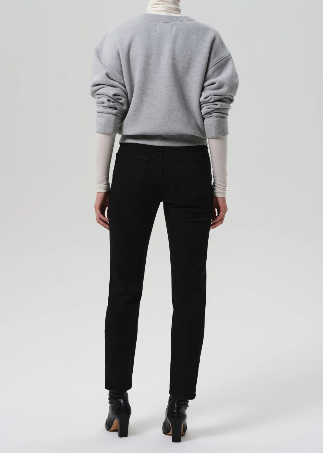 Close-up detail of Citizens of Humanity Isola Slim in Plush Black fabric showing the soft stretch denim.
