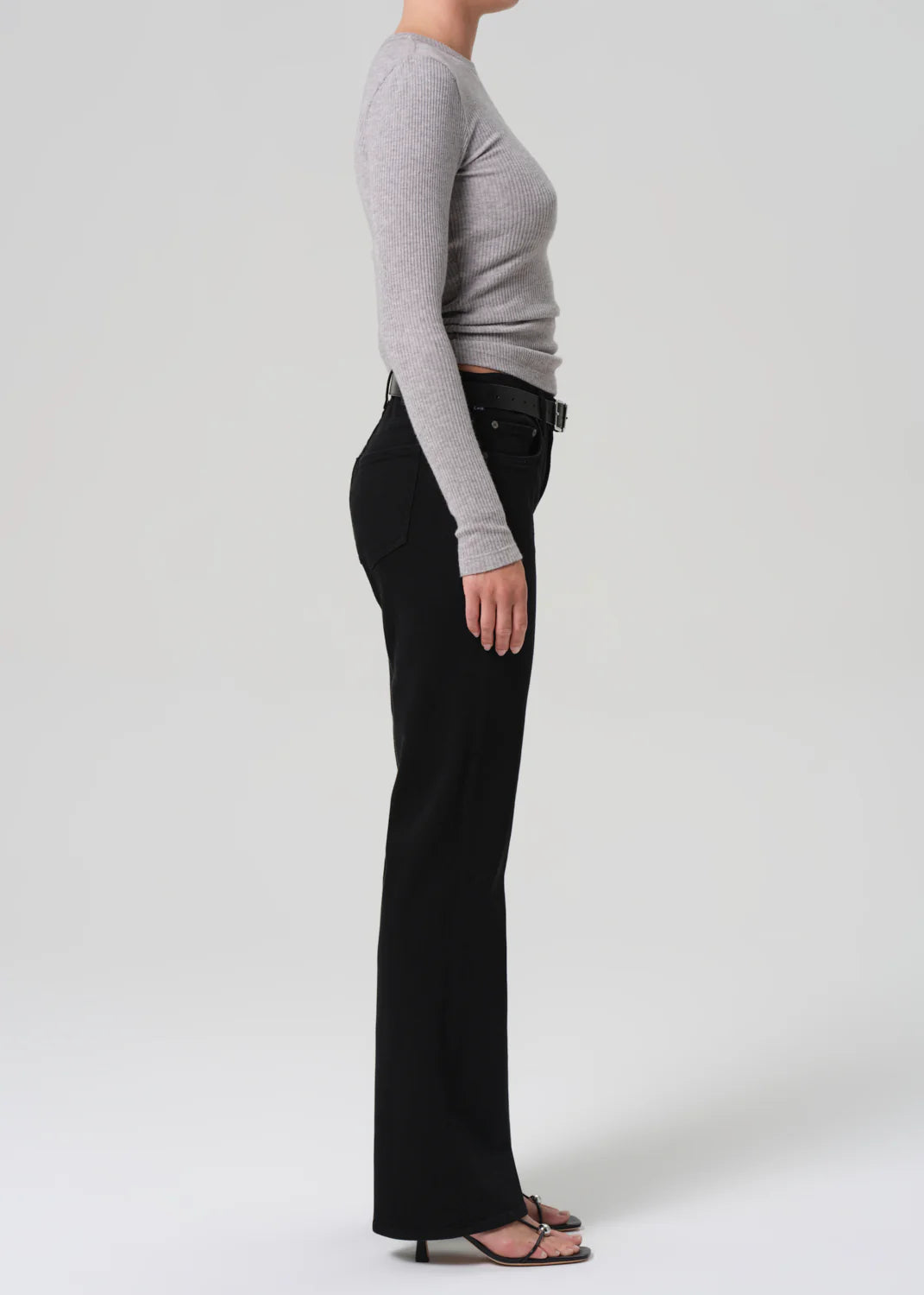 The Genova Low Rise Boot in Starless worn with an oversized sweater for a casual look.