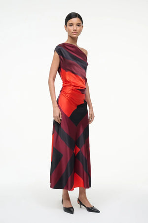 Full body view of the Staud Phare Silk Dress in Ruby Prism showcasing its ankle-grazing length.