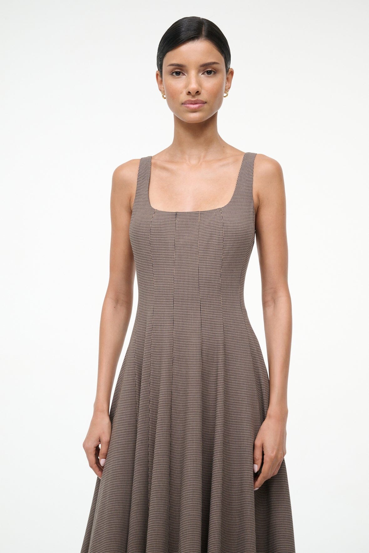 Stylish shot of the Staud Wells Dress in Houndstooth featuring lightweight wool blend texture