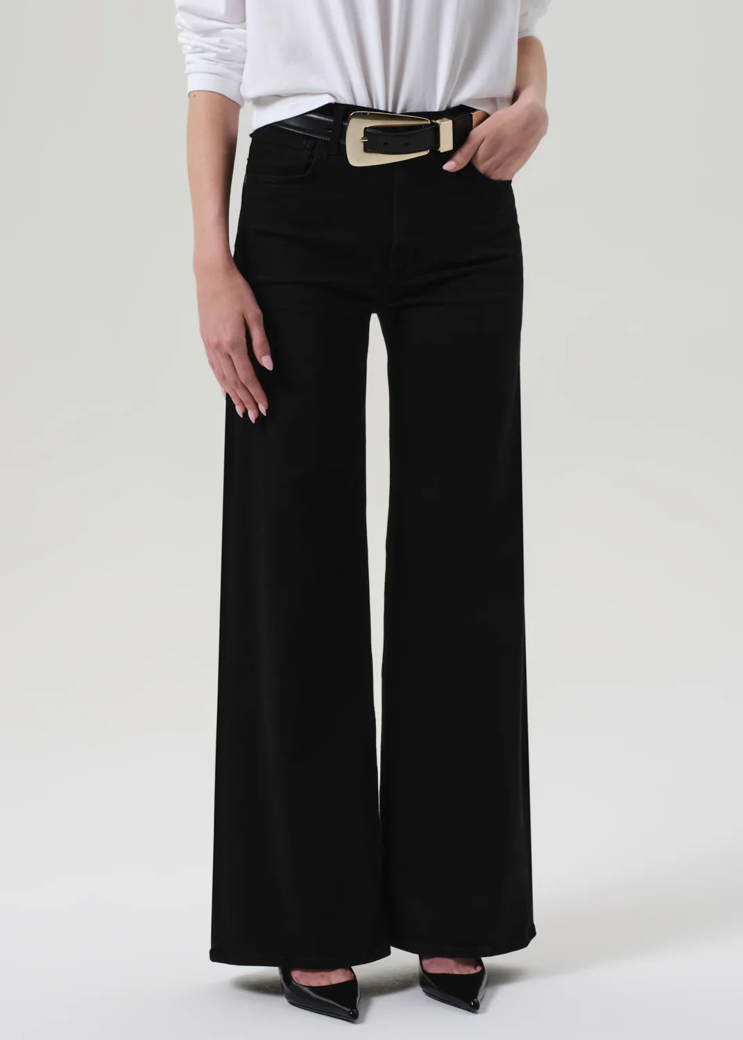 Lyra Long Wide Leg in Plush Black styled with sneakers, showcasing its versatility for casual looks.
