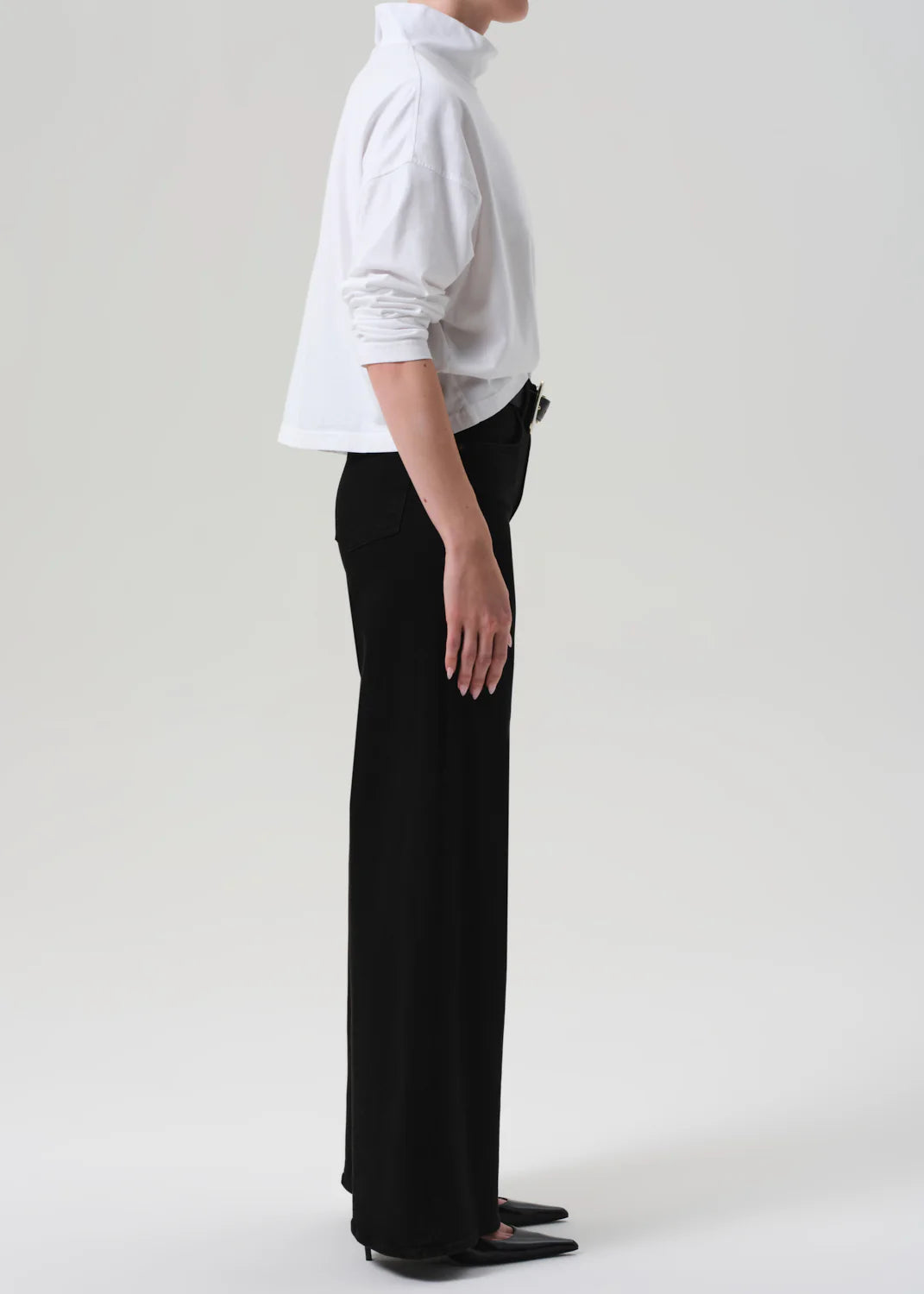 Side view of the Lyra Long Wide Leg in Plush Black highlighting its wide leg silhouette and relaxed fit.