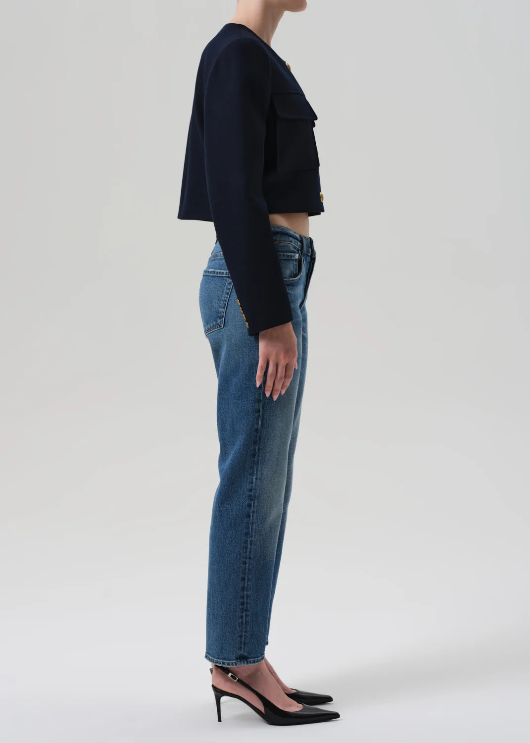 Model wearing Anissa Jeans in Alma, styled with a slouchy knit sweater for a relaxed urban look.
