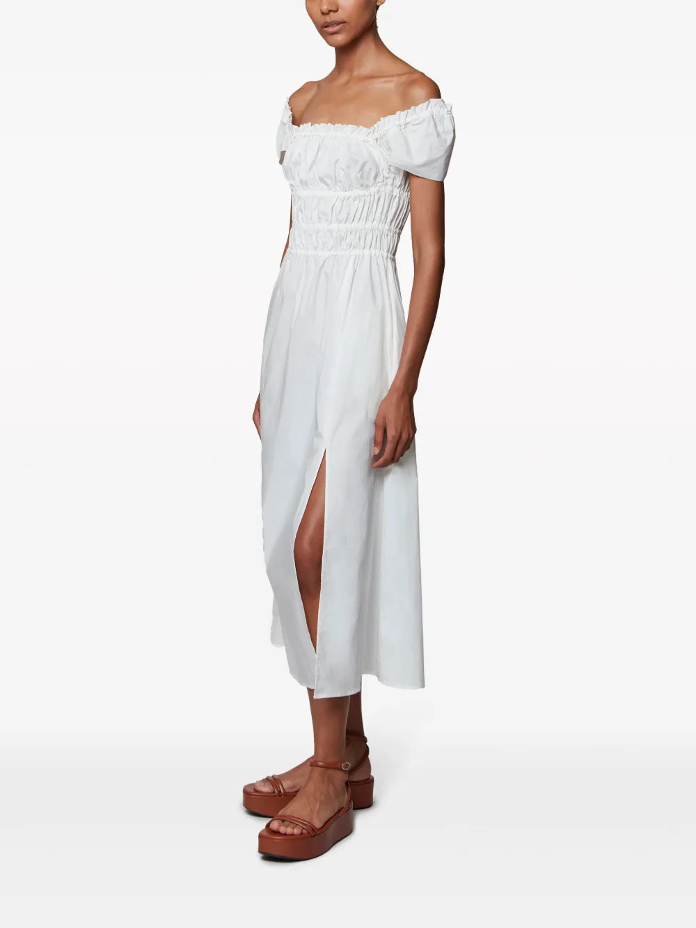 The Lily Dress in Optic White by Altuzarra, highlighting hidden pockets and a chic silhouette perfect for any occasion.