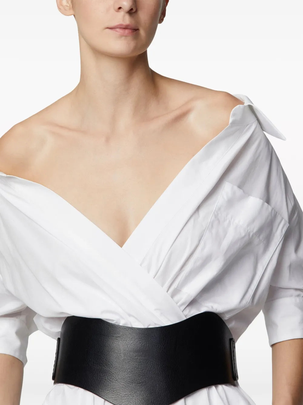 Back view of the Lydia Dress in Optic White by Altuzarra, showcasing the minimalist design and premium fabric.