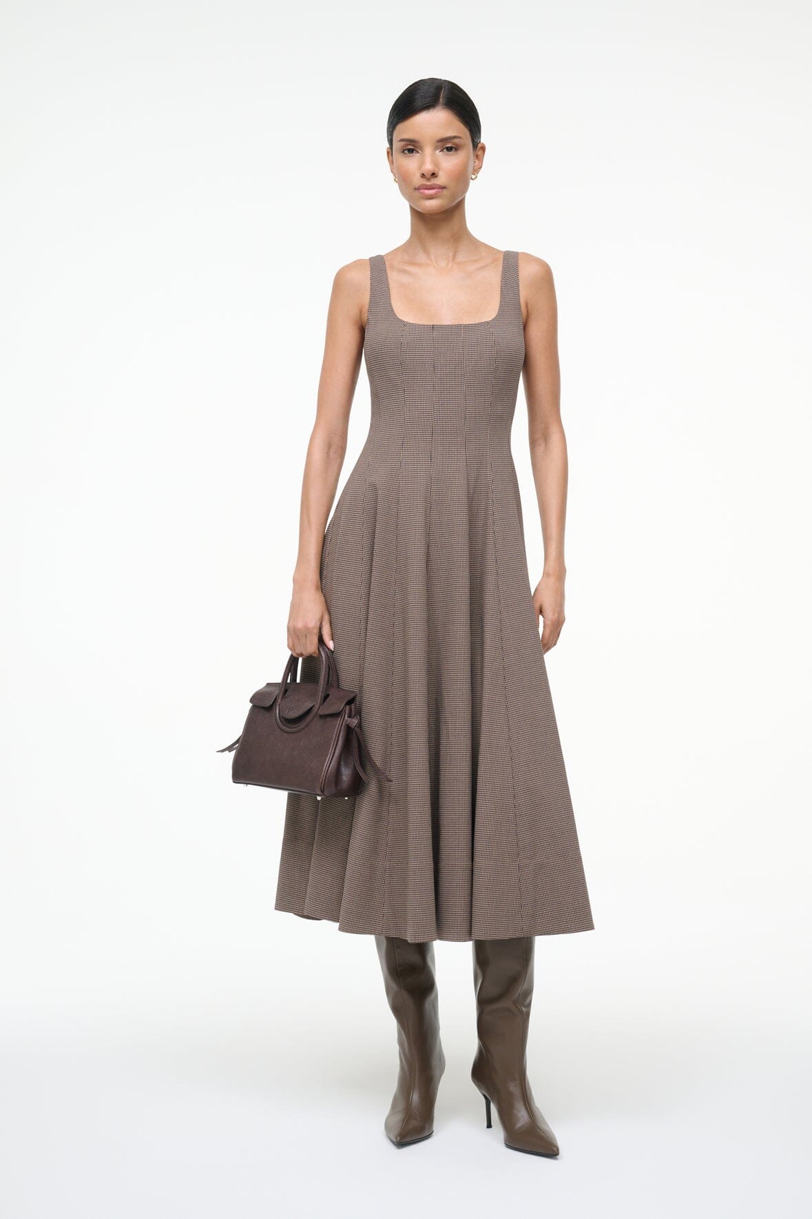 Side angle of Staud Wells Dress in Houndstooth showcasing its elegant silhouette and fitted design