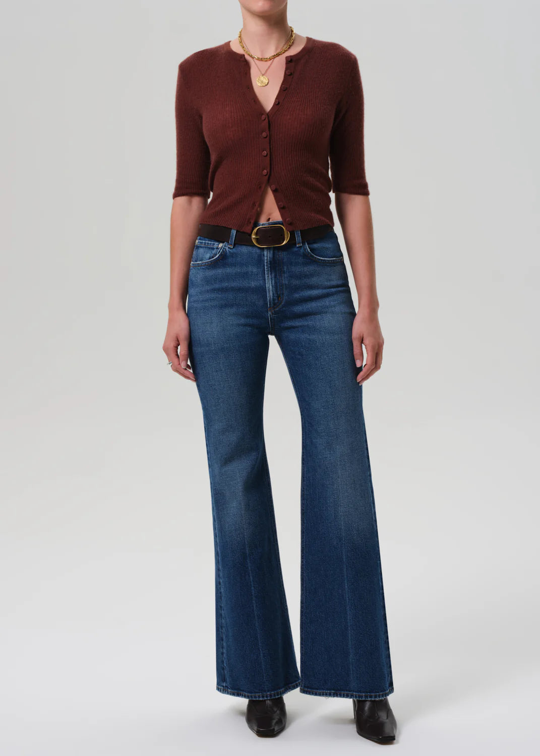 Close-up of Kimberly 70's Flare in Cruise, showcasing the soft fade and marbling of the medium-to-dark indigo denim.