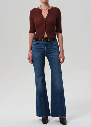 Close-up of Kimberly 70's Flare in Cruise, showcasing the soft fade and marbling of the medium-to-dark indigo denim.