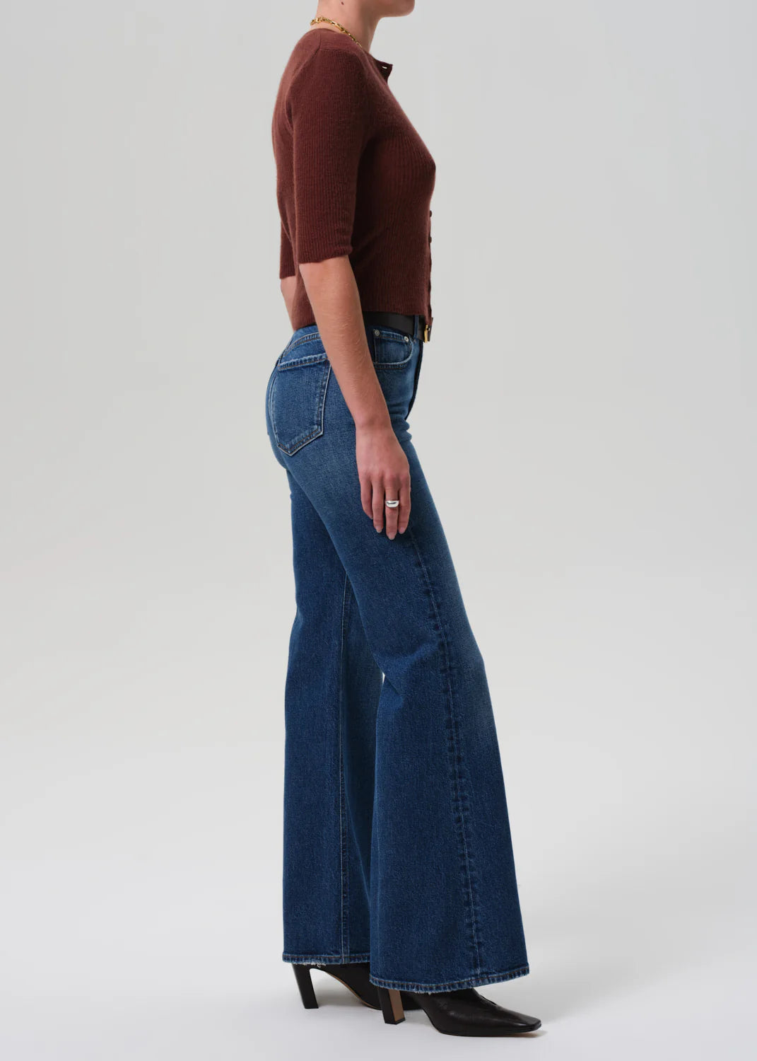 The back view of Kimberly 70's Flare in Cruise, highlighting its flattering silhouette and classic flare cut.