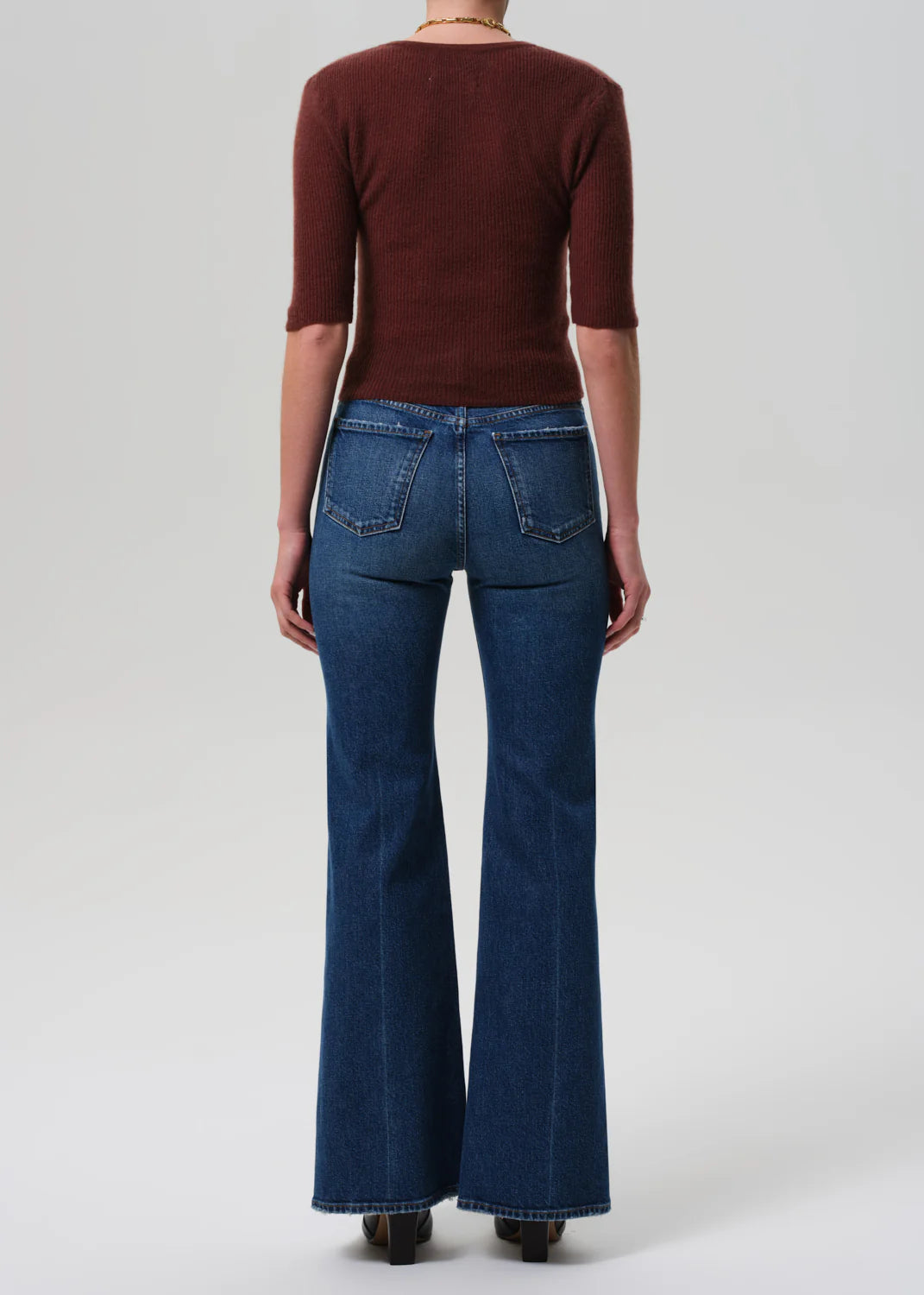 Kimberly 70's Flare in Cruise styled with a slim knit top, demonstrating a chic outfit for casual occasions.