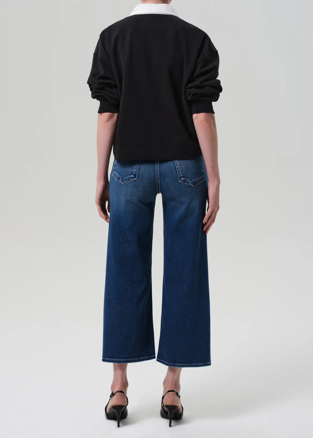 Close-up of the fabric of the Lyra Wide Leg Crop in Augusta showing the soft stretch denim and lightweight feel.