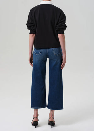 Close-up of the fabric of the Lyra Wide Leg Crop in Augusta showing the soft stretch denim and lightweight feel.