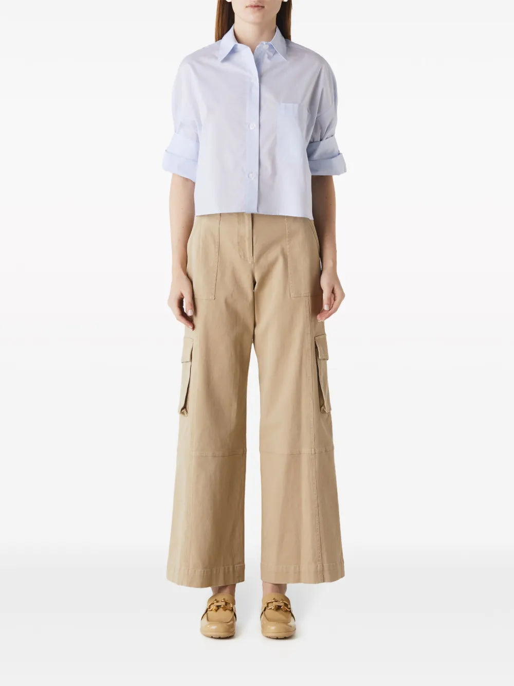 Next Ex in Baby Blue - Close-up of the chest patch pocket and button details on TWP's signature cropped shirt.