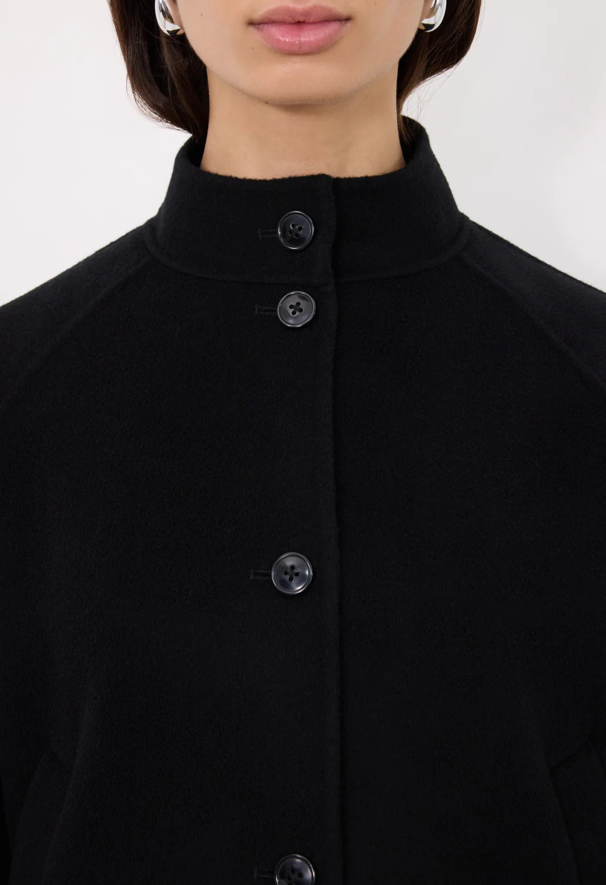 Back view of the Nyma Jacket in Black demonstrating its straight fit and modern aesthetic.