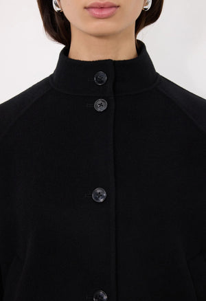 Back view of the Nyma Jacket in Black demonstrating its straight fit and modern aesthetic.