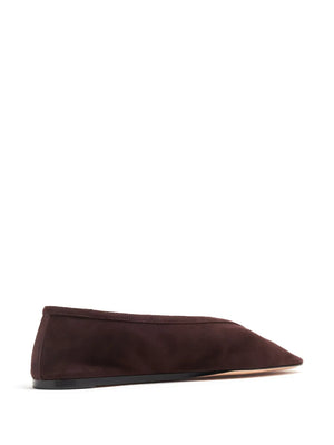 Close-up of Luna Slipper in Chocolate Suede featuring the cushioned calf leather insole and suede piping.