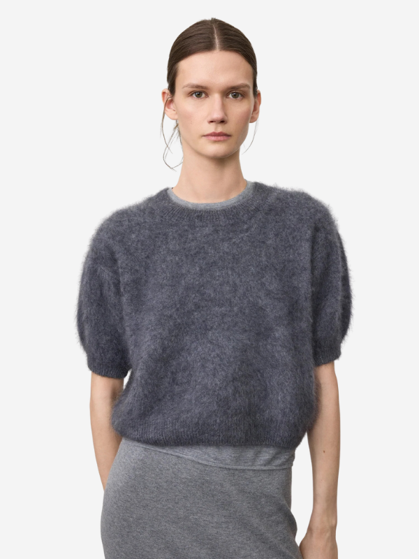 Model wearing the Juniper Sweater in Graphite with a relaxed fit and short sleeves.