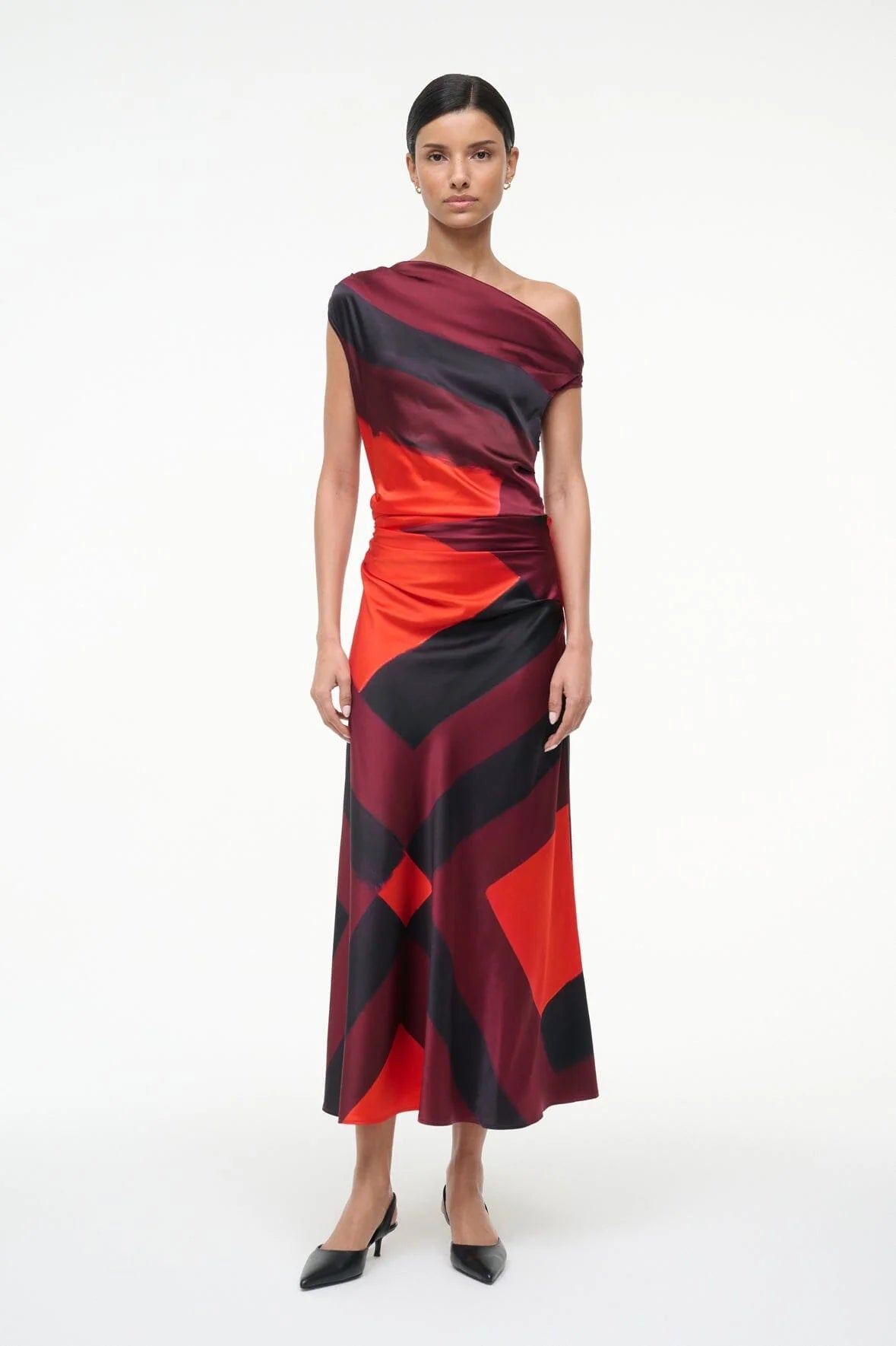 Close-up of Staud's Ruby Prism Phare Silk Dress detailing the fitted waist and luxurious silk fabric.