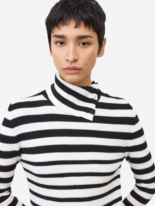 Model wearing the Sabrine Sweater in Salt/Noir Stripes, styled for a chic and casual outfit.