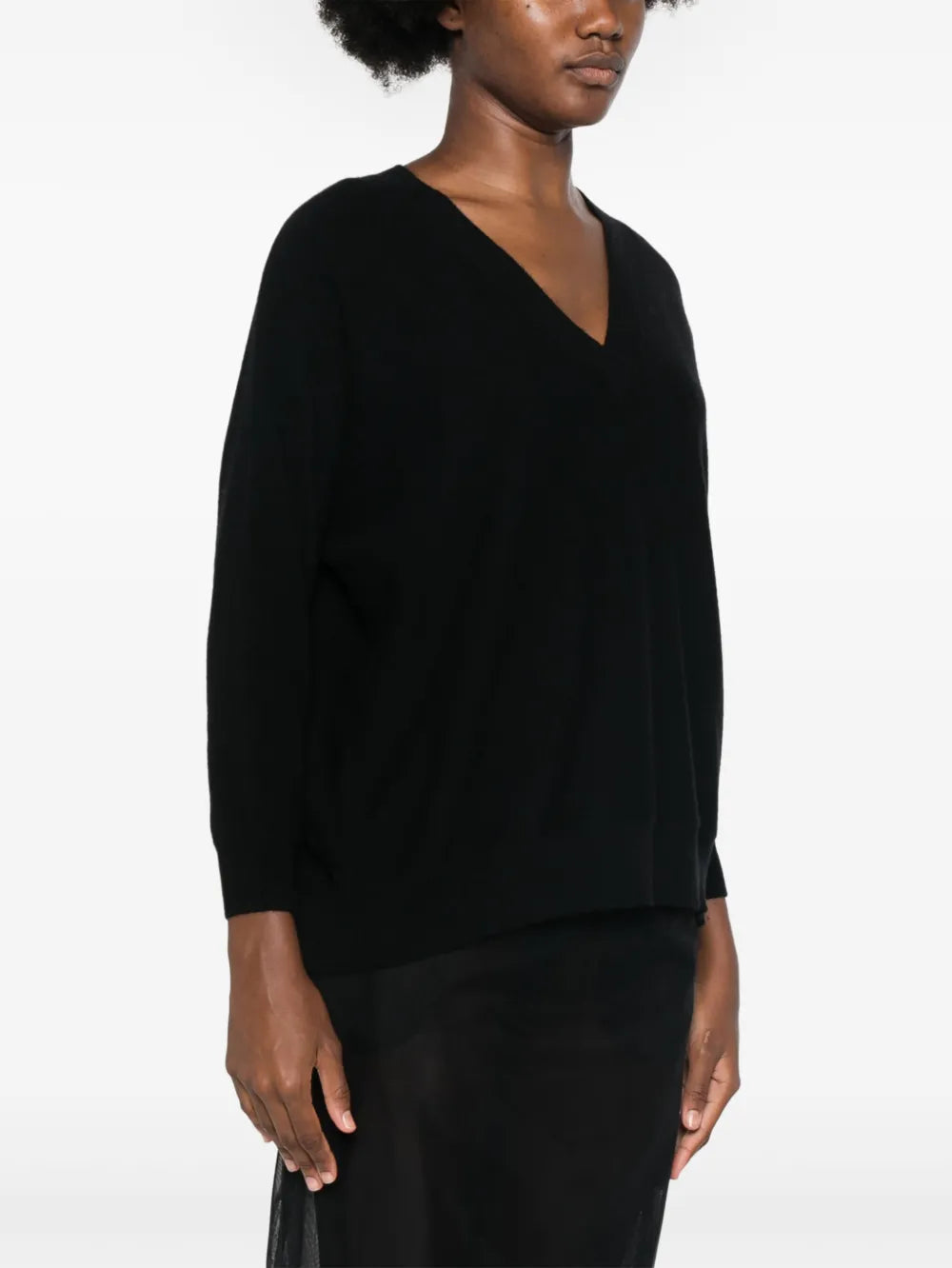 The Kenny Sweater in Black by Lisa Yang, featuring a relaxed fit, perfect for layering or draping.
