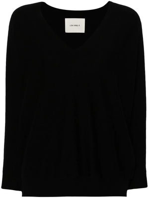 Kenny Sweater in Black by Lisa Yang, showcasing the exaggerated ribbed V-neckline and slouchy silhouette.