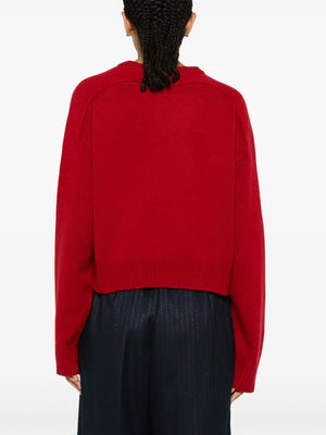 Back view of the Bruzzi LDS Crop Sweater in Red, highlighting its exquisite drop shoulder design and chic cropped silhouette by Loulou de Saison.