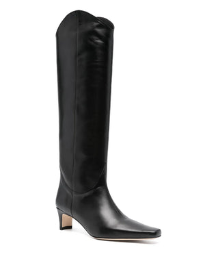 Close-up of the Western Wally Boot in Black by Staud, showcasing its luxurious cow leather and western-inspired design.