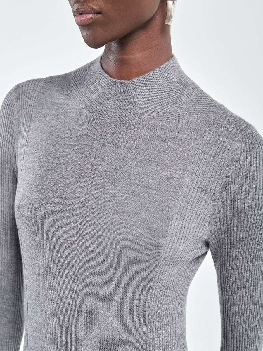 Close-up of the mock neck and ribbed sleeves of the Rib Godet Dress in Heather Grey, crafted from 100% Italian merino wool.