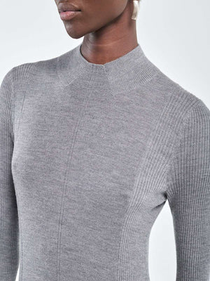 Close-up of the mock neck and ribbed sleeves of the Rib Godet Dress in Heather Grey, crafted from 100% Italian merino wool.