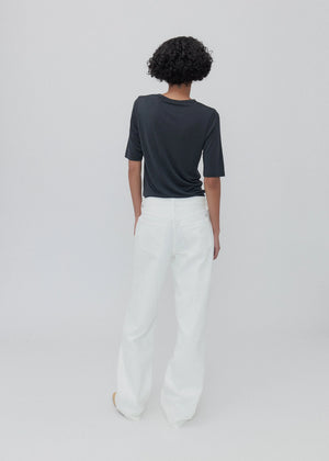 Close-up of the Everyday Jean in Milk highlighting the signature 'SH' embroidery.