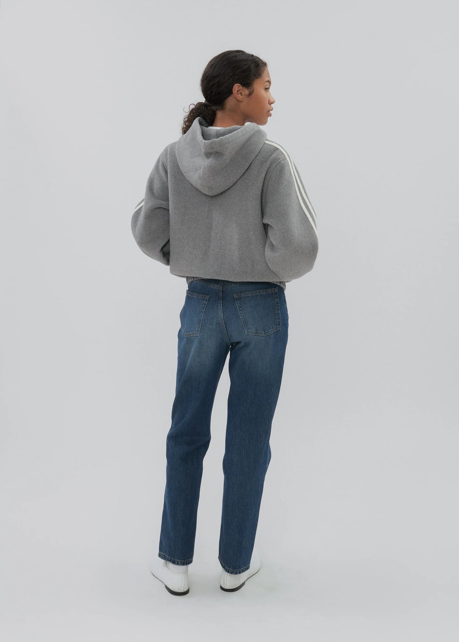 Close-up view of the Boyfriend Zip in Grey, highlighting the silky lining and front hand pockets.