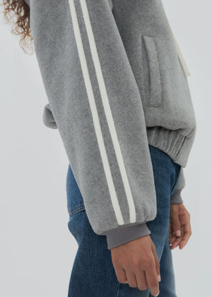 Model wearing the Boyfriend Zip in Grey, showcasing its versatility and casual fashion appeal.