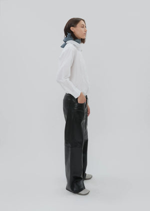 Close-up of the button fly and custom hardware on the Cool Jean in Black Leather.